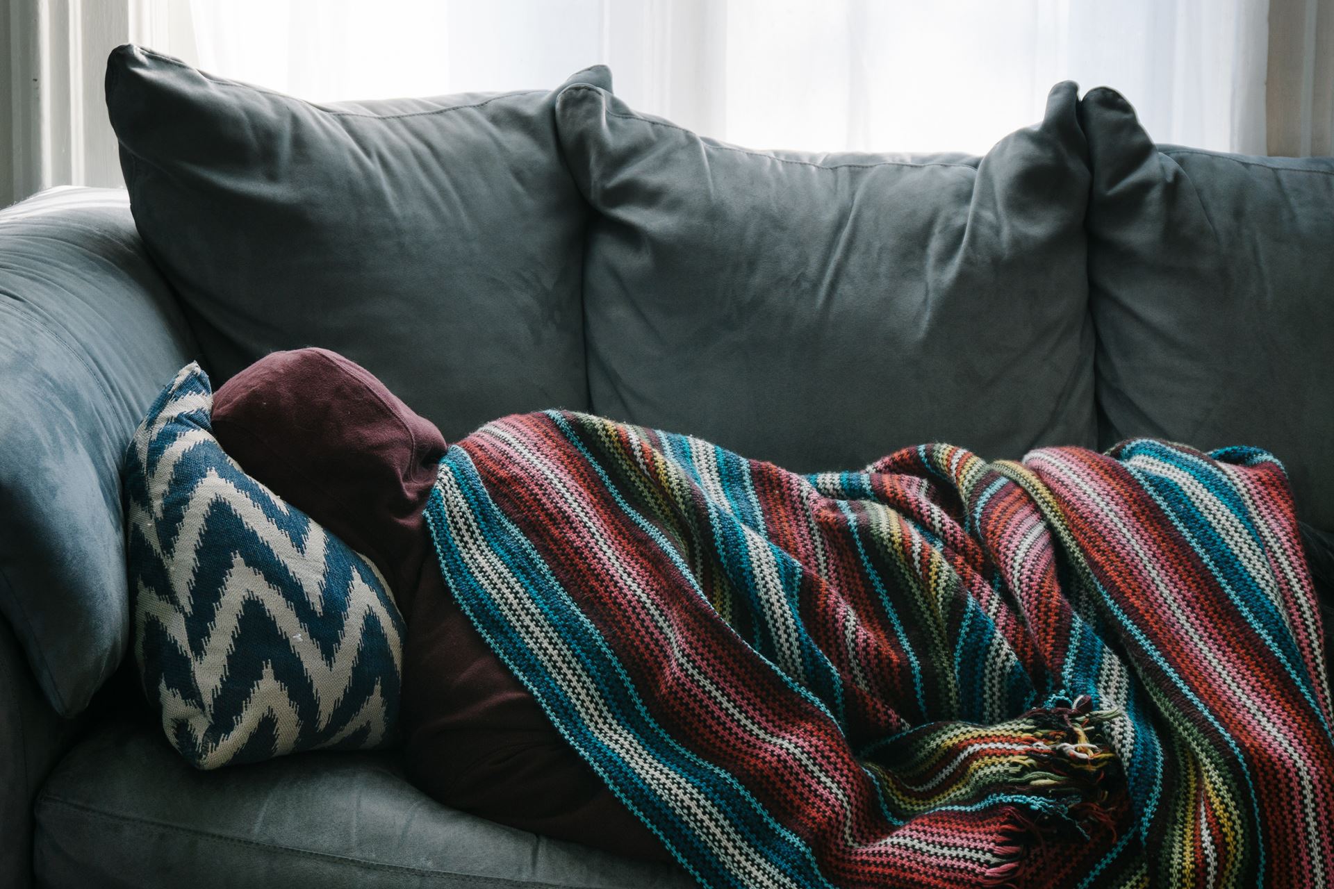 a person sleeping on a couch